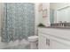 Clean bathroom with a shower/tub combo and modern vanity at 443 Dancing Water Dr, Winter Springs, FL 32708