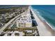 Aerial view of beachfront condo building with tennis court at 4575 S Atlantic Ave # 6209, Ponce Inlet, FL 32127