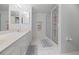 Bathroom with double vanity and walk-in shower at 4575 S Atlantic Ave # 6209, Ponce Inlet, FL 32127