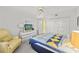 Bedroom with a queen bed, armchair, and built-in closet at 4575 S Atlantic Ave # 6209, Ponce Inlet, FL 32127