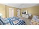 Guest bedroom with twin bed, dresser, and TV at 4575 S Atlantic Ave # 6209, Ponce Inlet, FL 32127