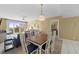 Dining area with table and chairs, view into living room at 4575 S Atlantic Ave # 6209, Ponce Inlet, FL 32127