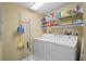 Laundry room with washer, dryer, and shelving at 4575 S Atlantic Ave # 6209, Ponce Inlet, FL 32127