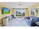 Living room with ocean view, comfy seating, and large TV at 4575 S Atlantic Ave # 6209, Ponce Inlet, FL 32127