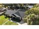 A home from above with landscaping, a driveway, and a nearby pool at 504 Birdsong Ct, Longwood, FL 32779