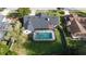 An aerial view showcasing the home's pool, fenced yard, and surrounding neighborhood at 504 Birdsong Ct, Longwood, FL 32779