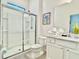 Clean and bright bathroom featuring a glass shower, white vanity, and modern fixtures at 6234 Sand Skipper Rd, Orlando, FL 32821