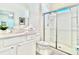 Contemporary bathroom with a glass shower, white vanity, and modern fixtures at 6234 Sand Skipper Rd, Orlando, FL 32821