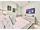 Light and airy bedroom with comfortable bedding and convenient amenities at 6234 Sand Skipper Rd, Orlando, FL 32821