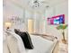 Modern bedroom with a comfortable bed, large TV, and simple decor at 6234 Sand Skipper Rd, Orlando, FL 32821