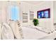 Modern bedroom with a comfortable bed, wall-mounted TV, and stylish decor at 6234 Sand Skipper Rd, Orlando, FL 32821