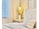 Cozy bedroom corner with soft lighting, stylish decor, and a comfortable bed at 6234 Sand Skipper Rd, Orlando, FL 32821