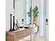 Welcoming entryway with a floating console table, mirror, and decorative accents at 6234 Sand Skipper Rd, Orlando, FL 32821