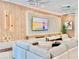 Modern living room featuring a large flat-screen TV and comfortable seating at 6234 Sand Skipper Rd, Orlando, FL 32821