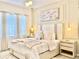 Modern main bedroom with a king-size bed, stylish nightstands, and elegant decor at 6234 Sand Skipper Rd, Orlando, FL 32821