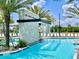 Community pool with cascading waterfall and ample seating at 6234 Sand Skipper Rd, Orlando, FL 32821