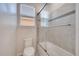 Bathroom with tub and shower, updated tile at 8048 Scagel St, Orlando, FL 32832