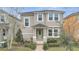 Two-story house with light beige siding, green door, and walkway at 8048 Scagel St, Orlando, FL 32832