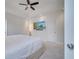 Spacious main bedroom with ceiling fan and en-suite bathroom at 8048 Scagel St, Orlando, FL 32832