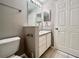 Bright bathroom with a toilet and vanity at 831 Camargo Way # 203, Altamonte Springs, FL 32714