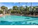Relaxing community pool area with lounge chairs at 831 Camargo Way # 203, Altamonte Springs, FL 32714