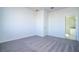 Bright bedroom with grey carpet and an ensuite bathroom at 904 Desmoines Way, Poinciana, FL 34759