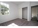 Bedroom with gray carpet, window, and sliding closet doors at 904 Desmoines Way, Poinciana, FL 34759