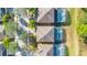 Birds-eye view of houses with pools and palm trees at 1028 Orange Cosmos Blvd, Davenport, FL 33837