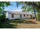 House back exterior view with patio and grassy yard at 1073 Humphrey Blvd, Deltona, FL 32738