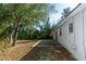 House back exterior view with patio and grassy yard at 1073 Humphrey Blvd, Deltona, FL 32738
