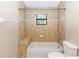 Bathroom with shower/tub combo and tile surround at 1073 Humphrey Blvd, Deltona, FL 32738