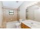 Bathroom with shower/tub combo, wood vanity, and tile flooring at 1073 Humphrey Blvd, Deltona, FL 32738