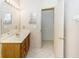 Bathroom with double vanity and access to another room at 1073 Humphrey Blvd, Deltona, FL 32738