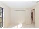 Bedroom with double door closet and view into another room at 1073 Humphrey Blvd, Deltona, FL 32738