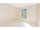 Simple bedroom with tile floors and window with natural light at 1073 Humphrey Blvd, Deltona, FL 32738