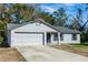 Single-story house with attached garage and front yard at 1073 Humphrey Blvd, Deltona, FL 32738