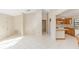 Open kitchen with light wood cabinets and tile floor at 1073 Humphrey Blvd, Deltona, FL 32738