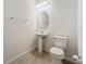 Simple half-bath with a pedestal sink and toilet at 12285 Joshua Tree Trl, Windermere, FL 34786