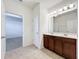 Double vanity bathroom with access to bedroom and linen closet at 12285 Joshua Tree Trl, Windermere, FL 34786