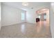 Open concept dining room with tile floors and archway to kitchen at 12285 Joshua Tree Trl, Windermere, FL 34786
