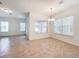 Spacious dining room with tile floors and large windows at 12285 Joshua Tree Trl, Windermere, FL 34786