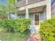 Front entrance with a covered porch and well-maintained landscaping at 12285 Joshua Tree Trl, Windermere, FL 34786