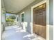 Covered front porch with access to the front door at 12285 Joshua Tree Trl, Windermere, FL 34786