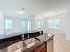Modern kitchen with stainless steel appliances and granite countertops at 12285 Joshua Tree Trl, Windermere, FL 34786