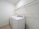 Laundry room with washer, dryer, and overhead shelving at 12285 Joshua Tree Trl, Windermere, FL 34786