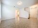 Spacious living room with tile floors and stairs to upper level at 12285 Joshua Tree Trl, Windermere, FL 34786