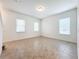 Bright living room with tile flooring and neutral walls at 12285 Joshua Tree Trl, Windermere, FL 34786
