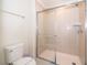 Clean bathroom with a shower and toilet at 1230 Aloha Blvd, Davenport, FL 33897
