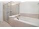 Clean bathroom with a shower/tub combo and tile surround at 1230 Aloha Blvd, Davenport, FL 33897
