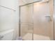 Clean bathroom with a shower and toilet at 1230 Aloha Blvd, Davenport, FL 33897